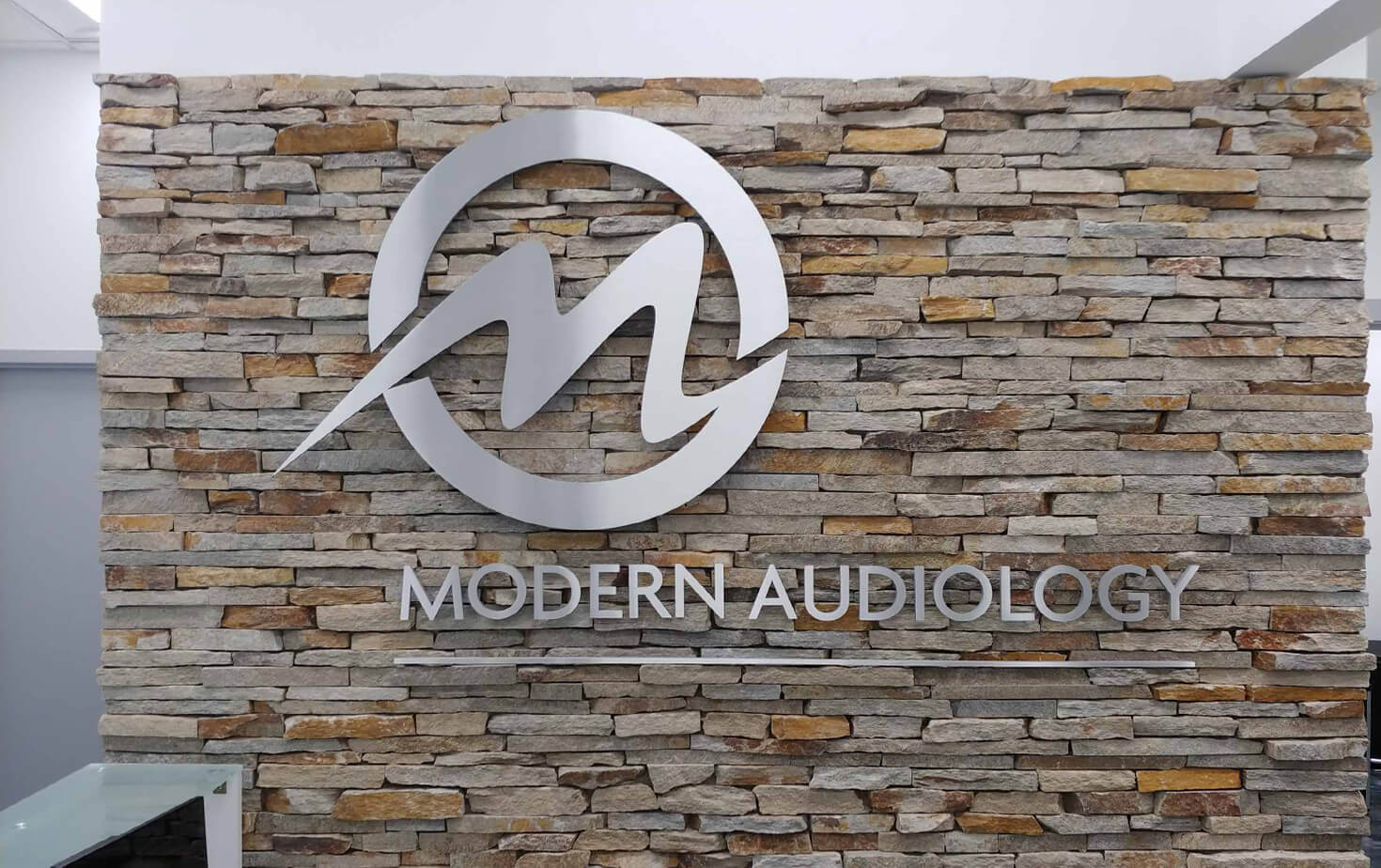 Modern Audiology  Richfield MN reception sign on Brick wall
