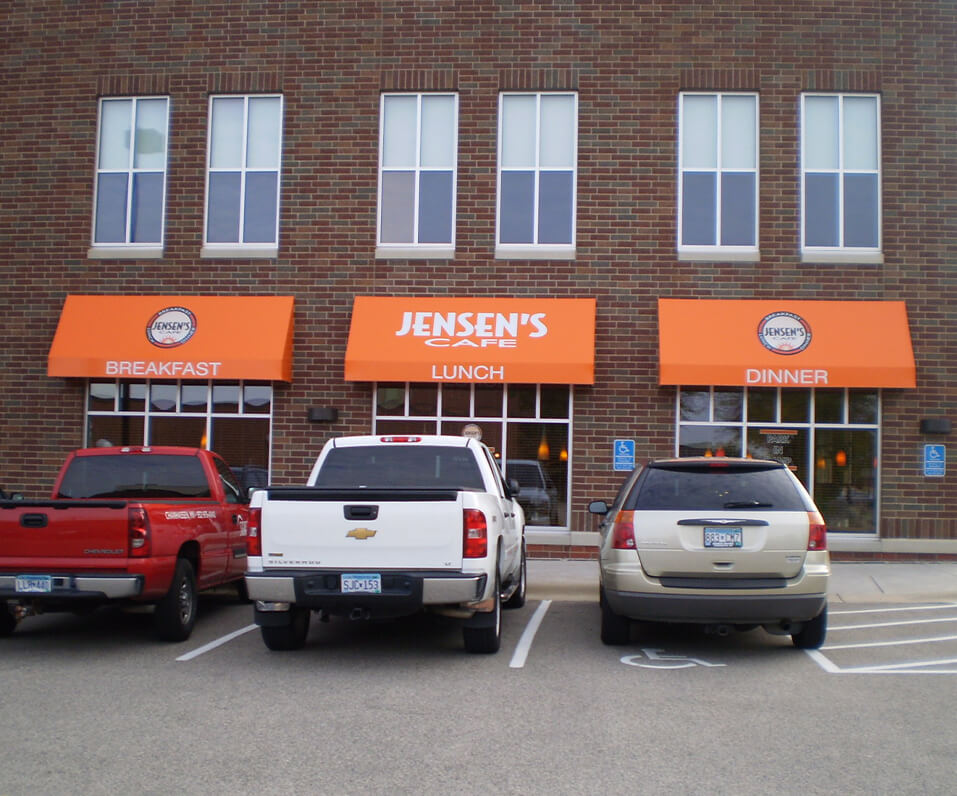 Jensons Cafe Burnsville MN Building front with three orange decorated awnings over windows