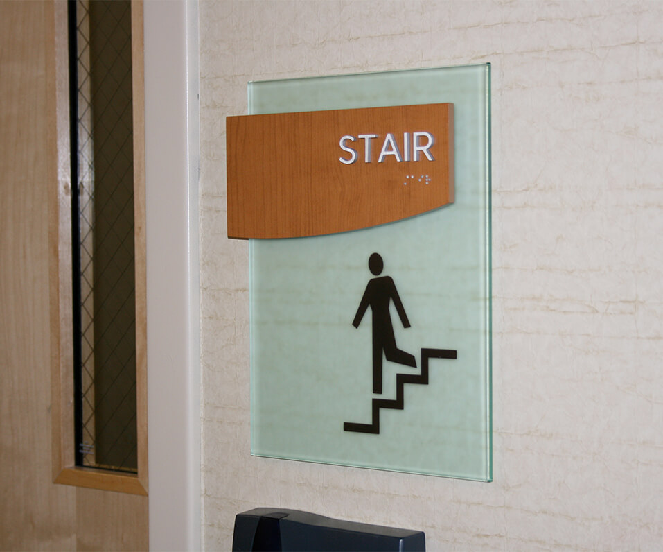 Maple Grove Hospital ADA Stair Sign with glass and wood accent
